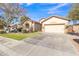 House exterior with a two-car garage and a spacious front yard at 3020 E Lark Dr, Chandler, AZ 85286