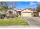 One-story home with a landscaped front yard and attached garage at 3020 E Lark Dr, Chandler, AZ 85286