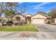 Single-story house with a two-car garage and well-manicured lawn at 3020 E Lark Dr, Chandler, AZ 85286