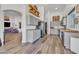 Modern kitchen with gray cabinets, stainless steel appliances, and wood flooring at 3020 E Lark Dr, Chandler, AZ 85286