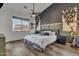 Spacious main bedroom with a ceiling fan and wood flooring at 3020 E Lark Dr, Chandler, AZ 85286