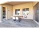 Covered patio with wooden table and chairs and sliding glass doors at 3020 E Lark Dr, Chandler, AZ 85286