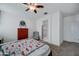 The bedroom with carpet flooring, ceiling fan, view of bathroom at 30263 W Pinchot Ave, Buckeye, AZ 85396