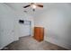 Neutral bedroom featuring carpet floors, ceiling fan, closet, and chest of drawers at 30263 W Pinchot Ave, Buckeye, AZ 85396