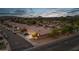 Overhead view of a residential area during sunset with houses and streets at 3102 W Louise Dr, Phoenix, AZ 85027