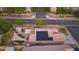 Backyard aerial view with pool, shade, and solar panels on roof at 3102 W Louise Dr, Phoenix, AZ 85027