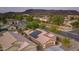 Aerial view of a home with solar panels, lush greenery, and neighborhood at 3102 W Louise Dr, Phoenix, AZ 85027