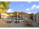 Expansive backyard with pool, covered patio, and mature landscaping, offering a private and serene outdoor space at 3102 W Louise Dr, Phoenix, AZ 85027