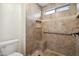 Accessible shower stall with a seat and tile surround at 3102 W Louise Dr, Phoenix, AZ 85027