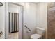 Accessible bathroom with grab bars, tiled floors, and walk-in shower at 3102 W Louise Dr, Phoenix, AZ 85027