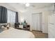 Cozy bedroom featuring a comfortable armchair and natural light at 3102 W Louise Dr, Phoenix, AZ 85027