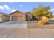 Charming single-story home with a two-car garage and low-maintenance front yard landscaping at 3102 W Louise Dr, Phoenix, AZ 85027