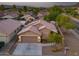 Inviting single-story home with a two-car garage, desert landscaping, and solar panels on a tile roof at 3102 W Louise Dr, Phoenix, AZ 85027