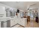 Bright kitchen features tile floors, stainless steel appliances, white cabinetry and sink overlooking eating area at 3102 W Louise Dr, Phoenix, AZ 85027