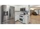 Well-equipped kitchen with white cabinets, stainless steel appliances, and double oven range for culinary enthusiasts at 3102 W Louise Dr, Phoenix, AZ 85027