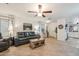 Open living area with tile floors, natural light, and comfortable furnishings, perfect for relaxation and entertaining at 3102 W Louise Dr, Phoenix, AZ 85027