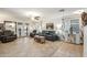 Bright living room with tile flooring, ceiling fan, and ample seating, creating a comfortable and inviting space at 3102 W Louise Dr, Phoenix, AZ 85027