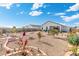 Landscaped backyard with desert landscaping and patio at 3560 N Mia Ln, Casa Grande, AZ 85122