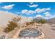 Landscaped backyard with desert plants and stone accents at 3560 N Mia Ln, Casa Grande, AZ 85122