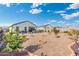 Large backyard with gravel and drought-tolerant landscaping at 3560 N Mia Ln, Casa Grande, AZ 85122