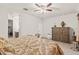 Spacious bedroom with large bed, dresser, and ceiling fan at 3560 N Mia Ln, Casa Grande, AZ 85122