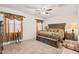 Bright bedroom with ceiling fan and decorative window treatments at 3560 N Mia Ln, Casa Grande, AZ 85122