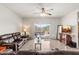 Spacious living room with leather furniture and sliding glass doors at 3560 N Mia Ln, Casa Grande, AZ 85122