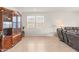 Living room featuring a large wooden cabinet and comfortable seating at 3560 N Mia Ln, Casa Grande, AZ 85122