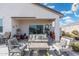 Covered patio with seating area and potted plants at 3560 N Mia Ln, Casa Grande, AZ 85122