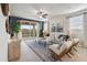 Living room with sliding doors leading to a backyard patio at 36060 W San Ildefanso Ave, Maricopa, AZ 85138