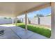 Covered patio overlooks a grassy backyard with block wall at 40440 N High Meadows Dr, San Tan Valley, AZ 85140