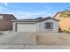 House exterior features a garage and neutral color scheme at 40440 N High Meadows Dr, San Tan Valley, AZ 85140