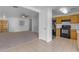 Neat kitchen with wood cabinets and black appliances at 40440 N High Meadows Dr, San Tan Valley, AZ 85140