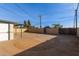 Backyard view, showing a large gravel area and fence at 4263 W Morten Ave, Phoenix, AZ 85051