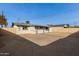 Large backyard with a circular driveway and gravel at 4263 W Morten Ave, Phoenix, AZ 85051