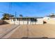 Backyard view of the house with gravel and a fence at 4263 W Morten Ave, Phoenix, AZ 85051