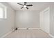 Bright bedroom with ceiling fan and laminate flooring at 4263 W Morten Ave, Phoenix, AZ 85051