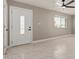 Bright entryway with tile flooring and a modern front door at 4263 W Morten Ave, Phoenix, AZ 85051