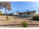 House exterior showcasing landscaping and a residential street at 4263 W Morten Ave, Phoenix, AZ 85051