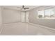 Living room featuring tile flooring and a ceiling fan at 4263 W Morten Ave, Phoenix, AZ 85051