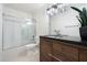 Modern bathroom with walk-in shower and wood vanity at 4316 N Parkway Ave, Scottsdale, AZ 85251