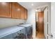 Bright laundry room with washer, dryer, and ample cabinetry at 4316 N Parkway Ave, Scottsdale, AZ 85251