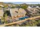 Aerial view of houses in a desert setting, showcasing mountain views and community at 4330 N Ranier Cir, Mesa, AZ 85215