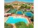 Aerial view of community pool, tennis courts and desert landscaping at 4330 N Ranier Cir, Mesa, AZ 85215