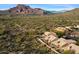 Aerial view showcasing a community with desert landscape and mountain views at 4330 N Ranier Cir, Mesa, AZ 85215