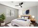 Serene bedroom with a wooden bed frame and neutral color scheme at 4330 N Ranier Cir, Mesa, AZ 85215