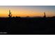 Scenic desert landscape at dusk with cacti silhouettes against colorful sky at 4330 N Ranier Cir, Mesa, AZ 85215