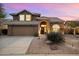 Beautiful two-story home with landscaped yard and a three-car garage at 4330 N Ranier Cir, Mesa, AZ 85215