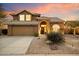 Two-story house with desert landscaping, attached garage, and welcoming entryway at 4330 N Ranier Cir, Mesa, AZ 85215