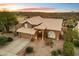 Two-story house with tile roof and desert landscaping, offering mountain views at 4330 N Ranier Cir, Mesa, AZ 85215